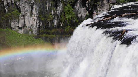 Still-shot-of-a-beautiful-rainbow-over-the-Upper-Mesa-Falls-waterfall