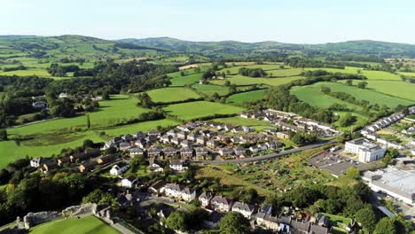 Denbighshire-town-residential-suburban-North-Wales-countryside-housing-estate-aerial-view-right-pan-shot