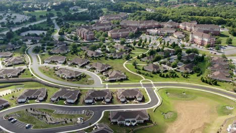 High-aerial-pan-of-large-retirement-home-community-village-in-United-States-of-America,-USA,-independent-and-assisted-living,-nursing-care-for-Medicare-senior-citizen-patients,-new-modern-facilities
