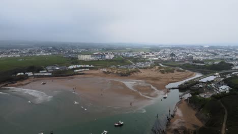 Aerial-4K-footage-Bude-Cornwall-beach-and-canal-overcast-day-dog-walkers-on-beach-high-angle
