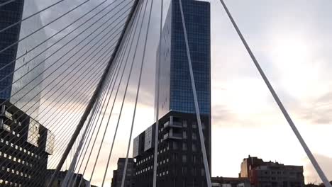 Walkig-througt-the-Calatrava´s-bridge-in-Bilbao-during-the-sunse