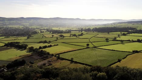 Beautiful-misty-North-Wales-countryside-rural-landscape-scene-aerial-view-pan-left