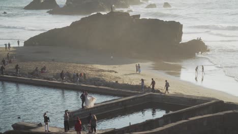 Tourists-and-a-Married-Couple-Enjoying-the-Sutro-Baths,-a-San-Francisco-Landmark,-During-an-Evening-in-California