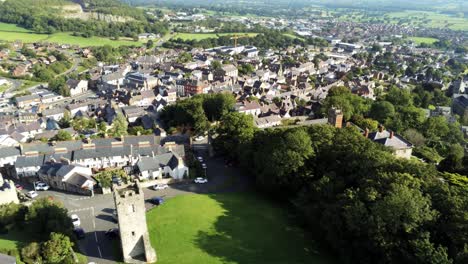 Welsh-medieval-St-Hilarys-tower-Denbighshire-residential-village-North-Wales-aerial-left-pan-tilt-down-view