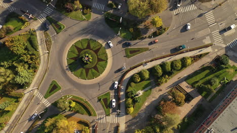 Flying-over-city-area-roundabout-in-morning