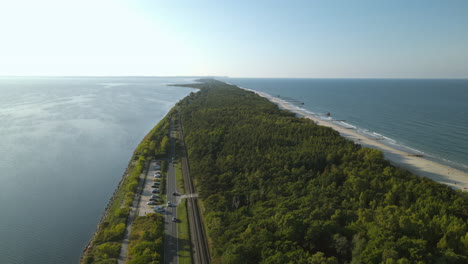 Narrow-stripe-of-land-with-sandy-beach-and-green-forest-in-middle-of-Baltic-Sea