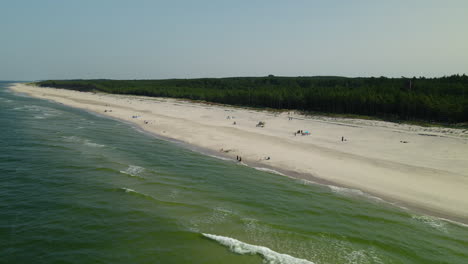 The-Beautiful-White-Sand-Beach-in-Osetnik,-Poland---Perfect-for-Summer-Vacation---Aerial-Shot