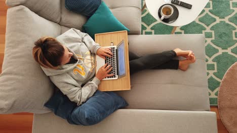 Work-from-home-freelancer-working-on-comfortable-sofa-with-computer