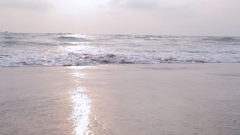 sunset-at-beach-waves-closeup-sun-shine-on-water