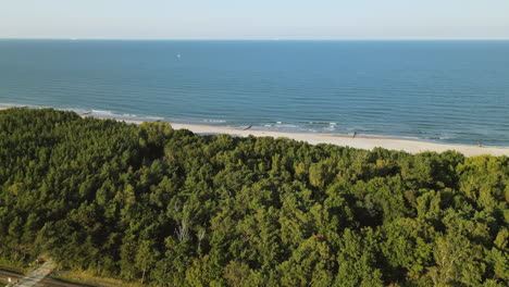 Slow-aerial-right-side-movement-over-Kuznica-beach,-a-tourist-spot-in-Hel-Peninsula,-Poland,-baltic-sea