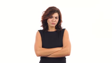 Displeased-upset-young-woman-crossing-her-arms-and-looking-in-the-camera-isolated-on-white-background