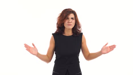 Displeased-upset-young-woman-waving-her-arms-in-a-mad-gesture-and-looking-in-the-camera-isolated-on-white-background