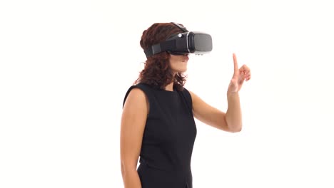 Young-businesswoman-is-working-using-virtual-reality-glasses-and-making-hand-gestures-isolated-over-white
