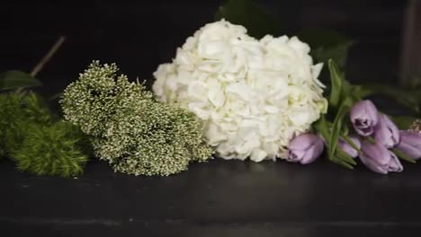 Panorama-footage-of-a-variety-of-beautiful-flowers-of-different-colors-and-types.-Indoors