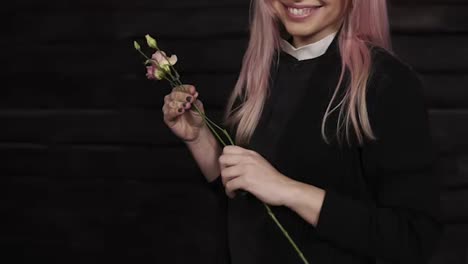Close-up-footage-of-a-stunning-long-haired-young-woman-chooses-flowers-for-a-bouquet.-Purple-tulips