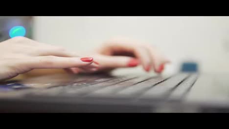 Woman's-hands-typing-on-computer.-Closeup-view