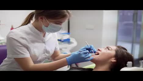Oral-hygiene-and-dental-care:-Doctor-dentist-working-with-patient-in-dental-clinic.-Healthcare-concept.