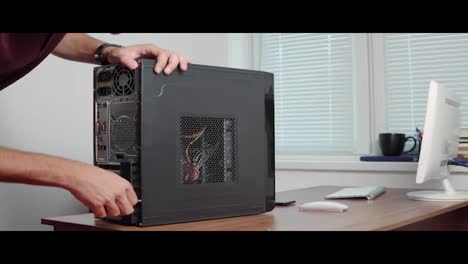 Professional-computer-repairer-man-upgrading-computer-hardware.-Shot-in-4k