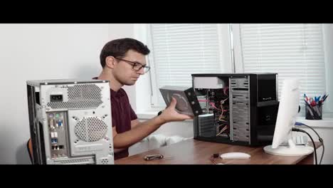 Computer-service-worker-fixing-broken-computer-in-the-office-and-upgrading-computer-hardware.-Support-team.-4k