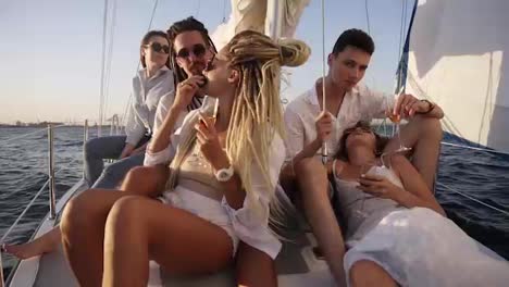 Young-people-relaxing-on-a-yacht.-Party-on-a-yacht.-Corporate-party-on-a-yacht.-Young-people-having-fun-on-a-yacht.-Walk-on-a-yacht-along-the-river.-Cruise-on-a-boat.-Close-up