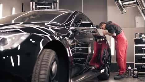 Process-of-polishing-stunning-new-black-car.-Slomotion-footage.