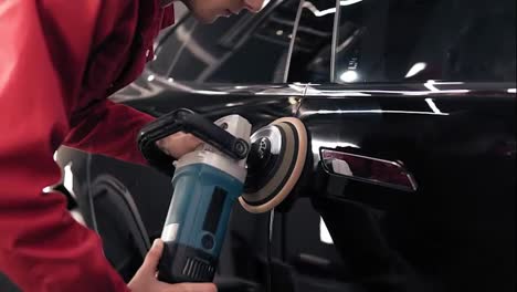 Getting-rid-of-streaks-on-new-black-car-by-polishing-it-with-professional-mashine.-Slomotion-footage.
