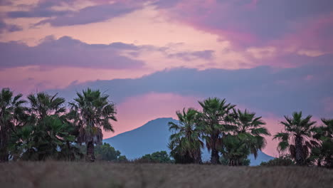 Cloudscape-Over-Mountains-And-Tropical-Palm-Trees.-Timelapse