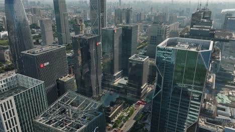 Aerial-view-around-technology-company-high-rise-in-sunny-Guangzhou-city,-China