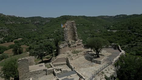 The-flag-of-Catalonia-flies-above-the-ruins-of-the-Castell-de-Calders