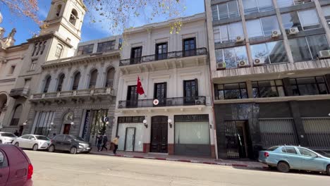 Turkish-consulate-facade,-with-Turkish-flag-waving-gently-above-the-entrance