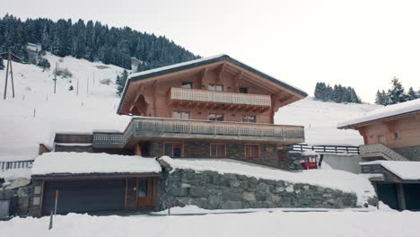Jib-up-of-luxurious-chalet-in-snow-covered-landscape
