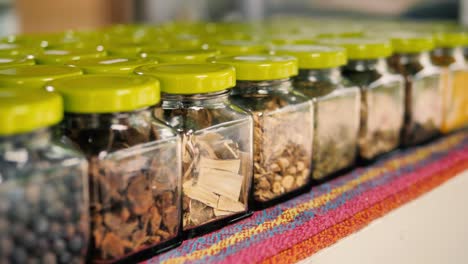 Various-jars-of-seeds,-4k,-slowmo