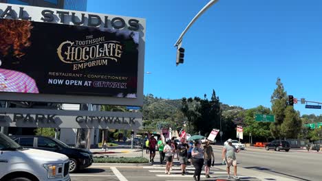 Strike-in-Hollywood,-Writers-Guild-of-America-Union-Protesting-With-Signs-in-Front-of-Universal-Studios,-Los-Angeles-CA-USA
