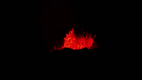 Exploding-volcano-eruption-with-molten-magma-at-night