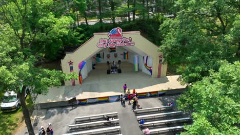 Aerial-view-of-Lititz-Springs-Park-amphitheater-setting-up-for-a-pride-festival-on-a-beautiful-summer-afternoon
