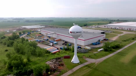 West-Branch,-Iowa-water-tower-with-drone-video-moving-in