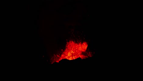 Magma-ejecting-from-crater-at-night,-volcano-eruption,-Iceland