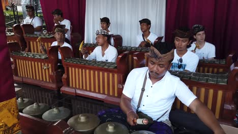 Musicians-Play-Gamelan-Percussion-Gongs-Traditional-Culture-of-Bali,-Indonesia,-Balinese-Hinduism-Rhythmic-Sounds