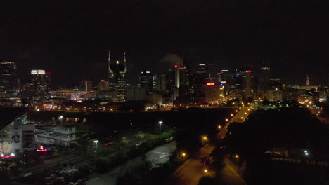 Moving-exterior-4k-shot-aerial-of-Nashville-skyline-at-night