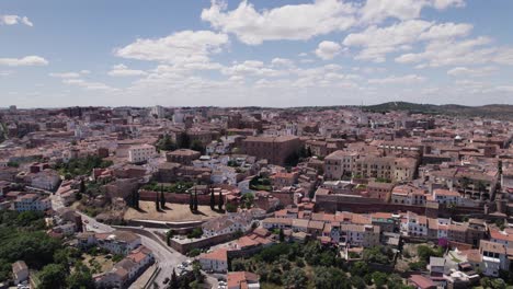 Aerial-View-approaching-Caceres-medieval-cityscape,-UNESCO-World-Heritage-In-Extremadura,-Spain