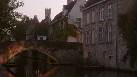 Pan-shot-at-dusk-from-the-Historic-center-of-Bruges,-considered-as-one-of-Europe's-most-beautiful-UNESCO-site