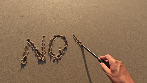 "No-War"-word-is-written-on-the-sandy-beach