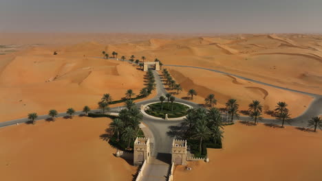 Aerial-view-over-a-roundabout-and-a-road-in-middle-of-the-desert-in-sunny-middle-UAE