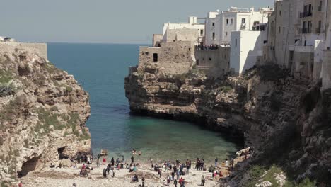 Aerial-view-of-the-sea-and-beach-from-Polignano-a-Mare,-Puglia,-Italy