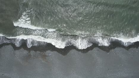 Waves-breaking-on-a-shingle-beach-at-low-tide-on-the-Copper-Coast-Waterford-on-a-warm-July-day