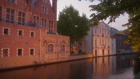 Facade-Exterior-Of-Architectures-At-The-Channel-During-Night-In-Bruges,-Belgium