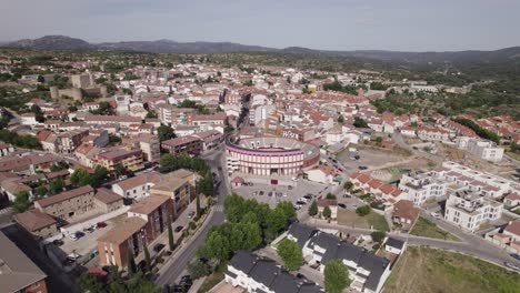 Aerial-view-circling-Spanish-Plaza-de-Toros-bullring-in-the-scenic-San-Marti-n-de-Valdeiglesias-municipality