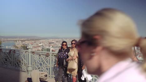 Tourists-posing-for-the-photographs-overlooking-city-of-Pest-from-Buda-Gellert-hill-viewpoint