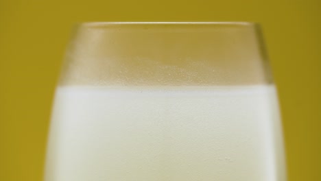 Cold-white-liquid-in-the-glass,-frosted-glass