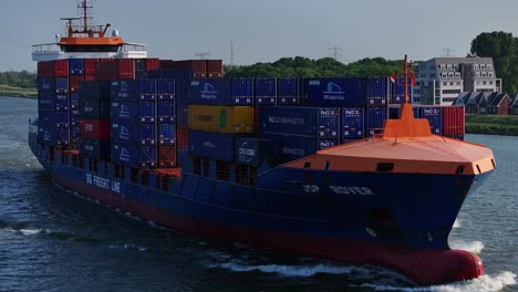 Large-container-ship-at-sea-loaded-with-company-containers-for-offshore-supply,-Aerial-view